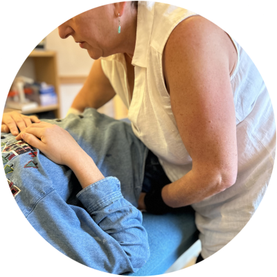 Jamie Rose practising Zero Balancing on a patient lying on a couch